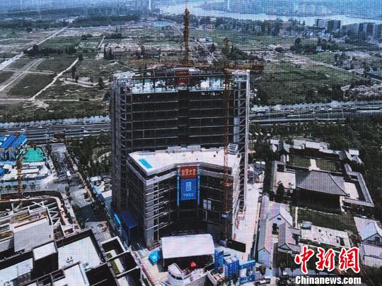 上海自貿區首家中外合資醫療機構萊佛士醫院封頂 上海自貿區首家中外合資醫療機構萊佛士醫院封頂
